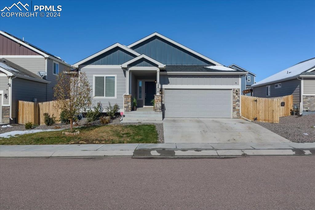 View of front facade featuring a garage