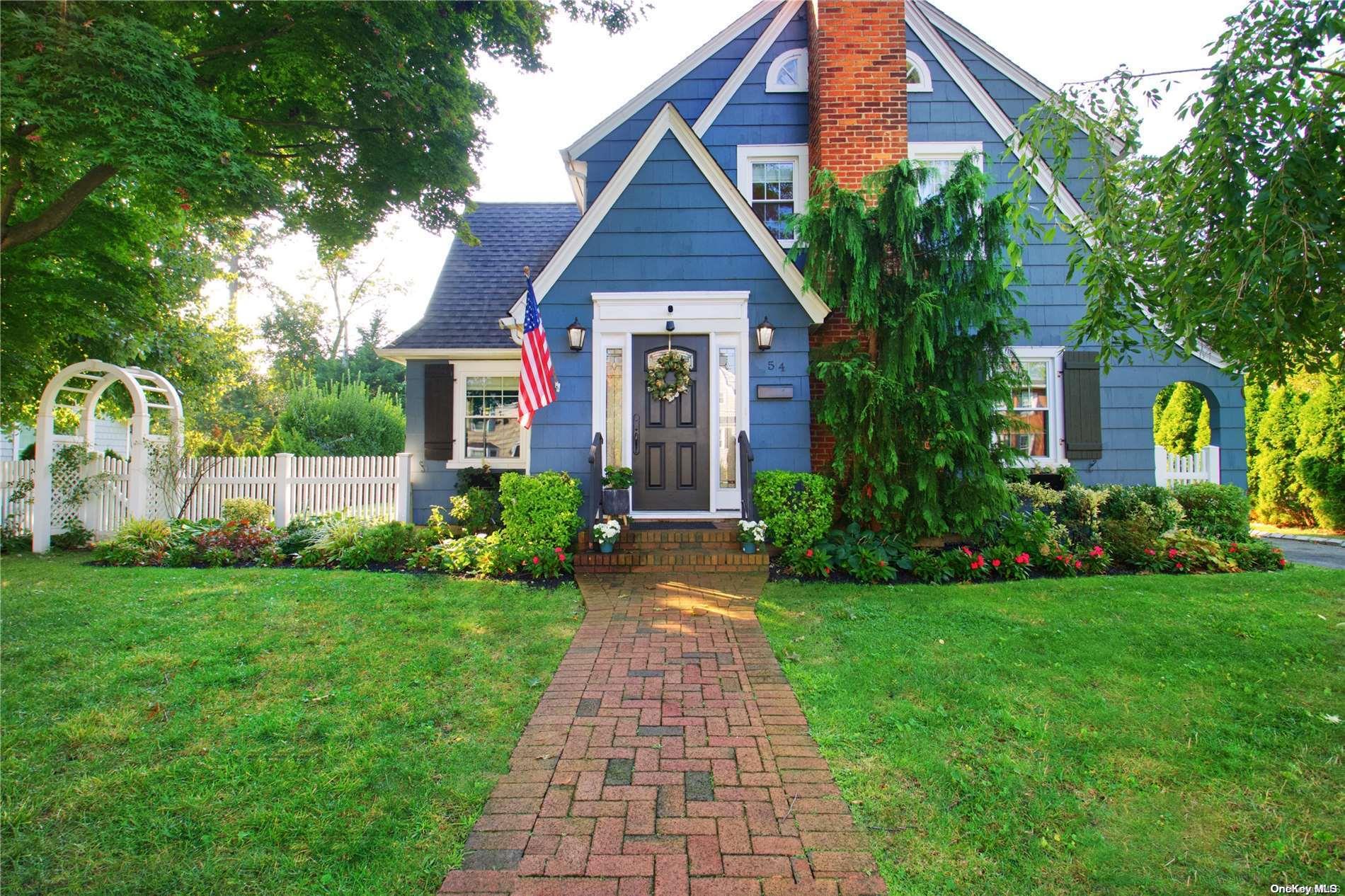 a front view of house with garden