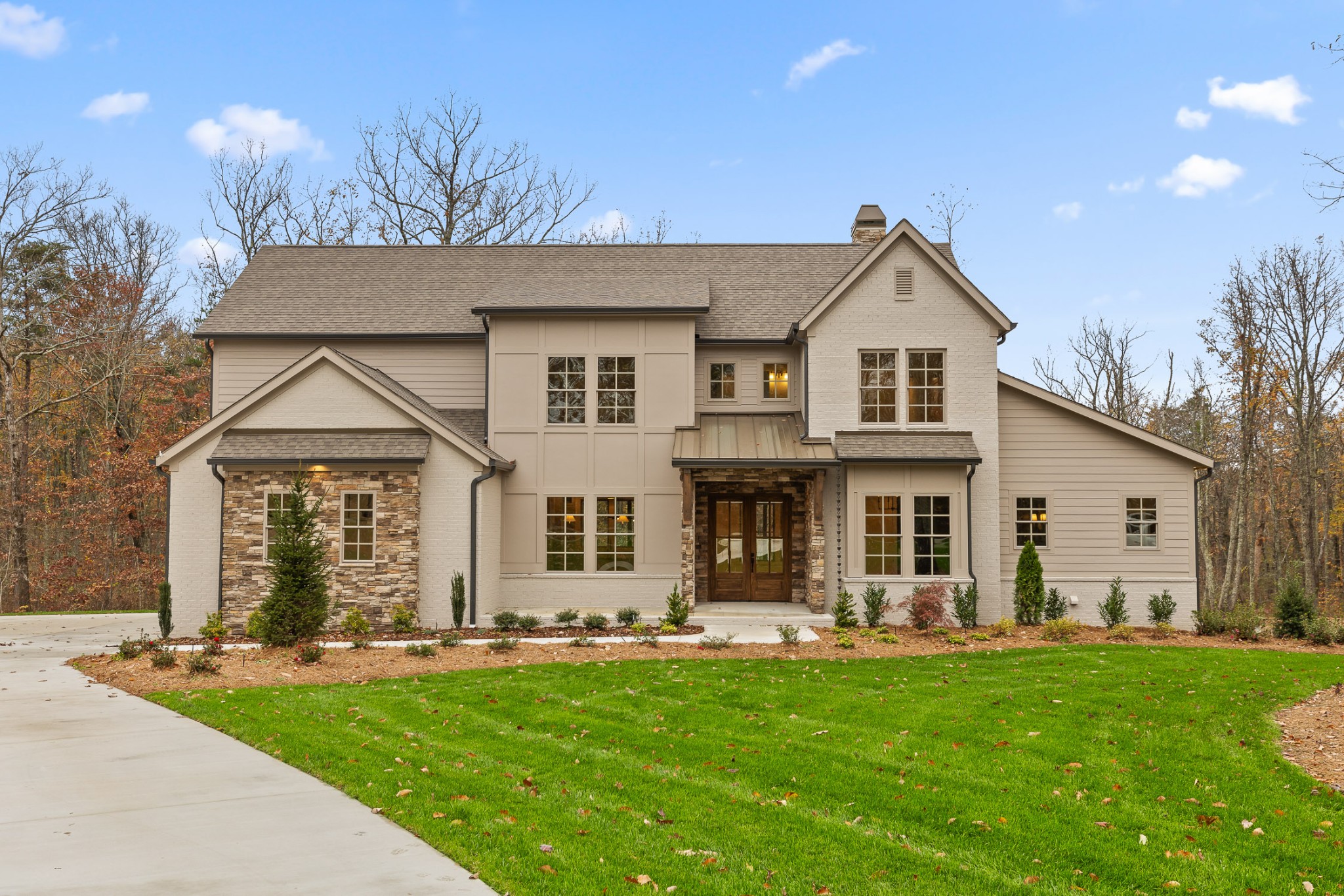 front view of a house with a yard