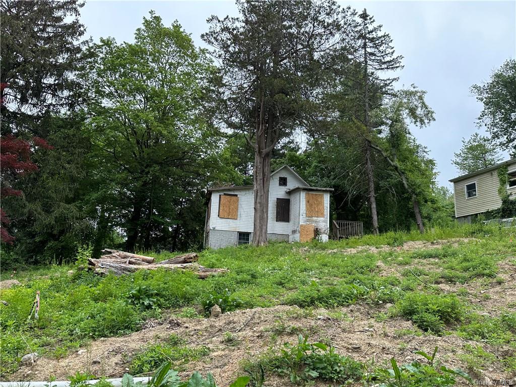 a house with trees in the background