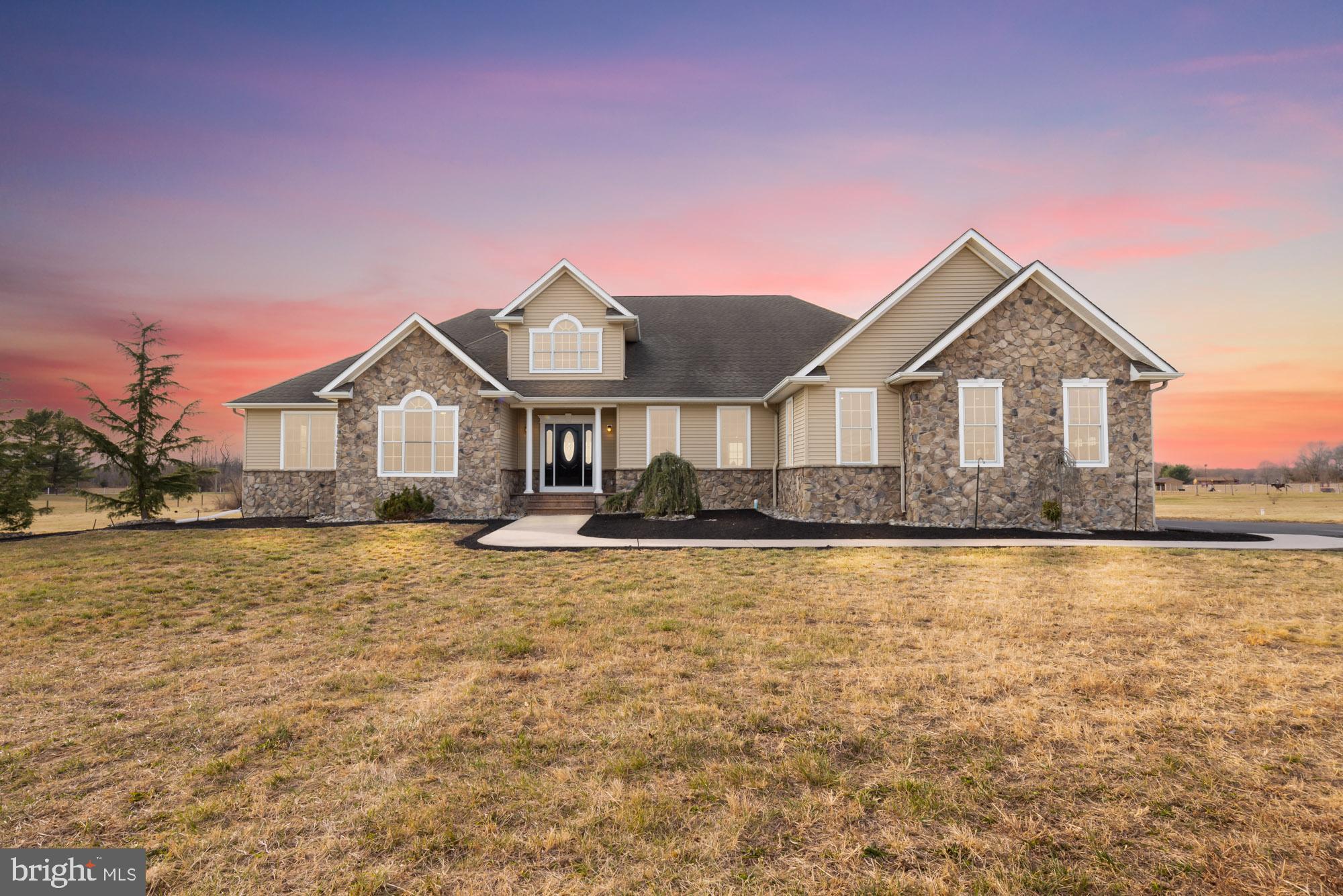 a front view of a house with yard