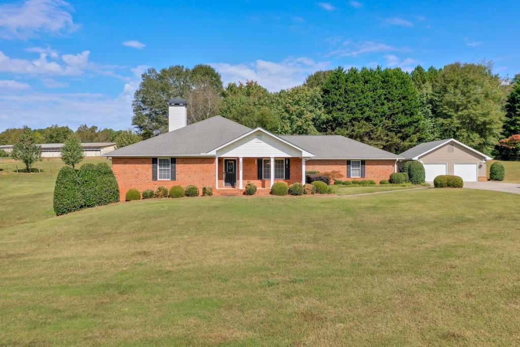 a front view of a house with a yard