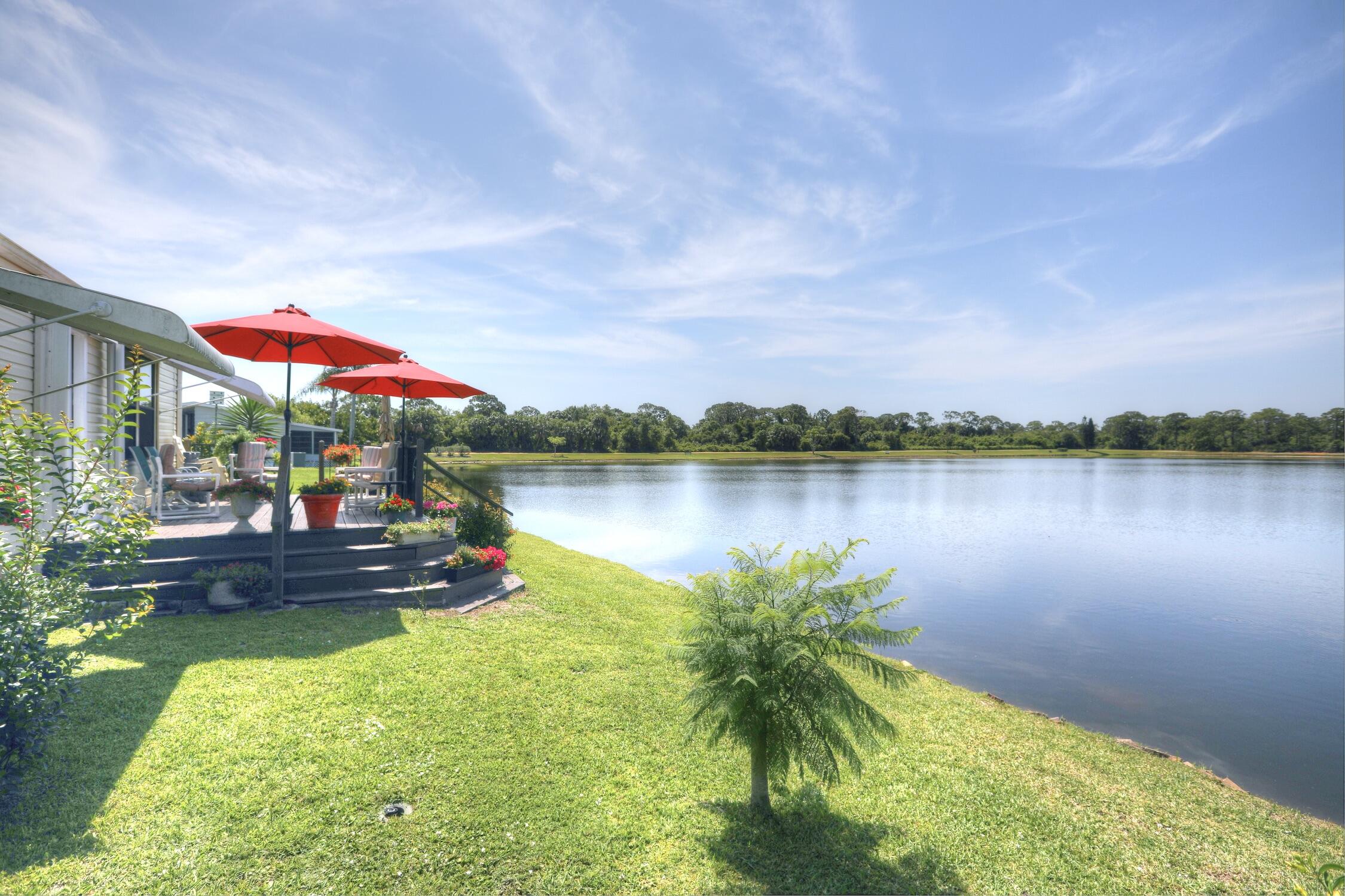 a view of a lake with a house in the background