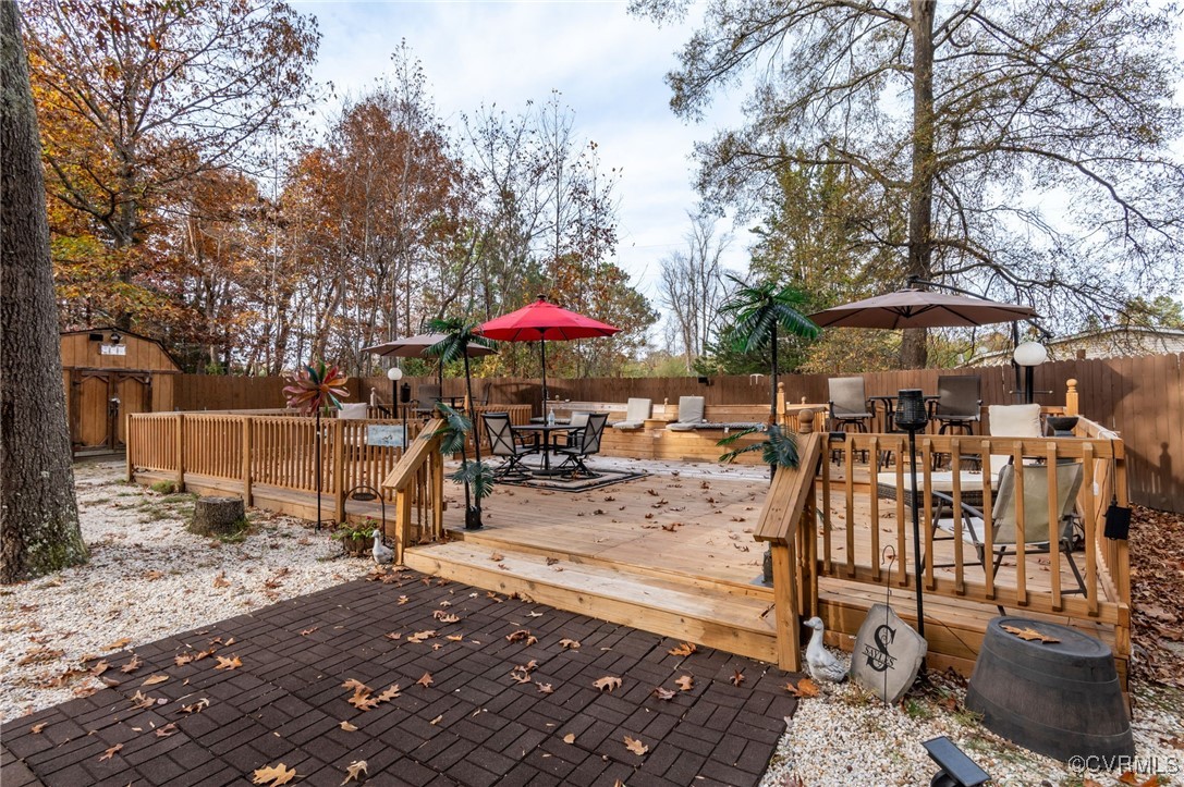 an outdoor space with patio lots of furniture and umbrella