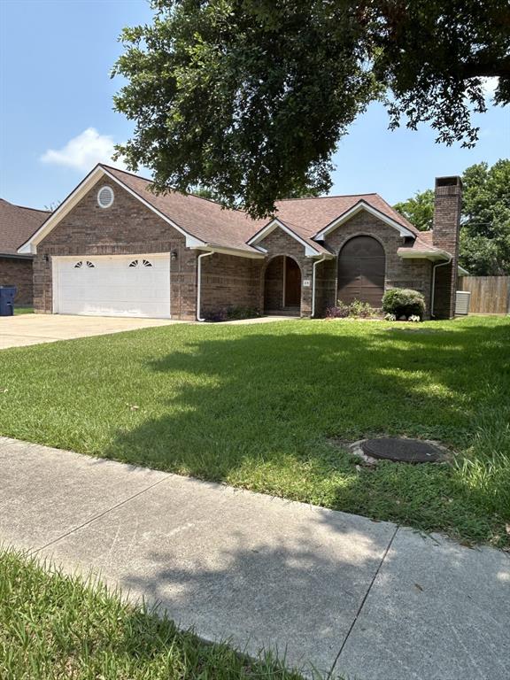 a front view of a house with yard