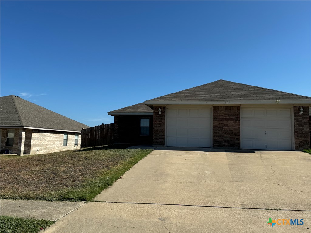 a front view of a house with yard