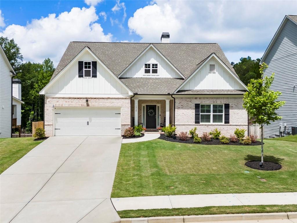 a front view of a house with a yard