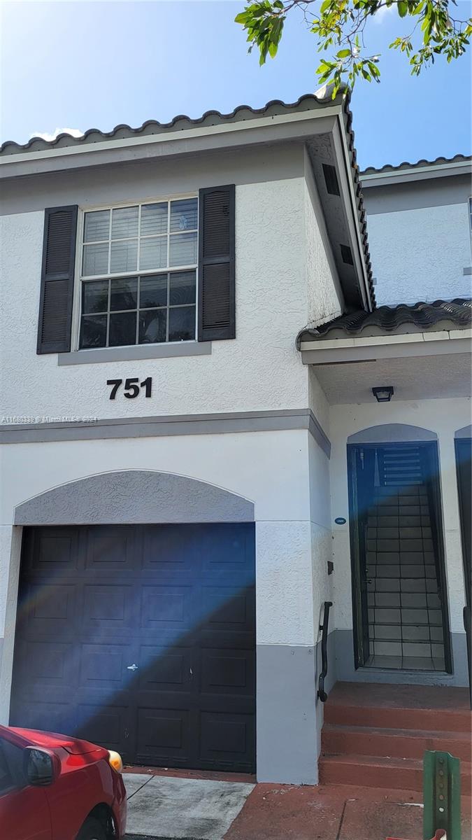 a front view of a house with windows