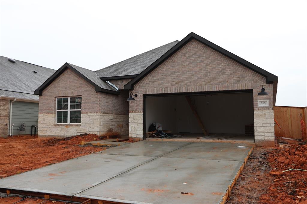 a front view of a house with a garage