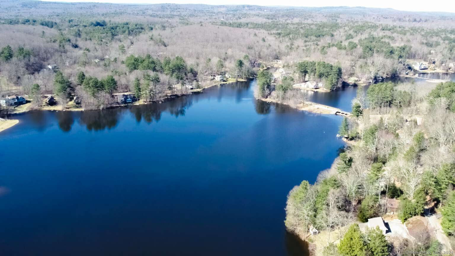 an aerial view of residential house with outdoor space and lake view