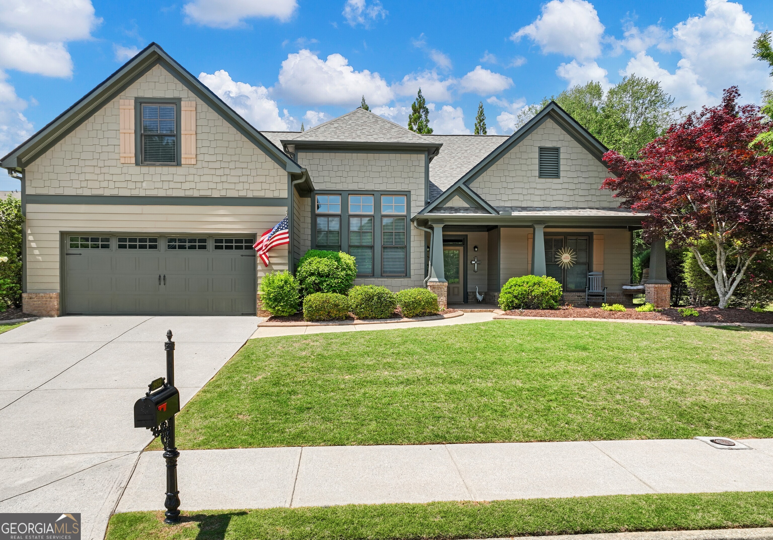 a front view of a house with garden