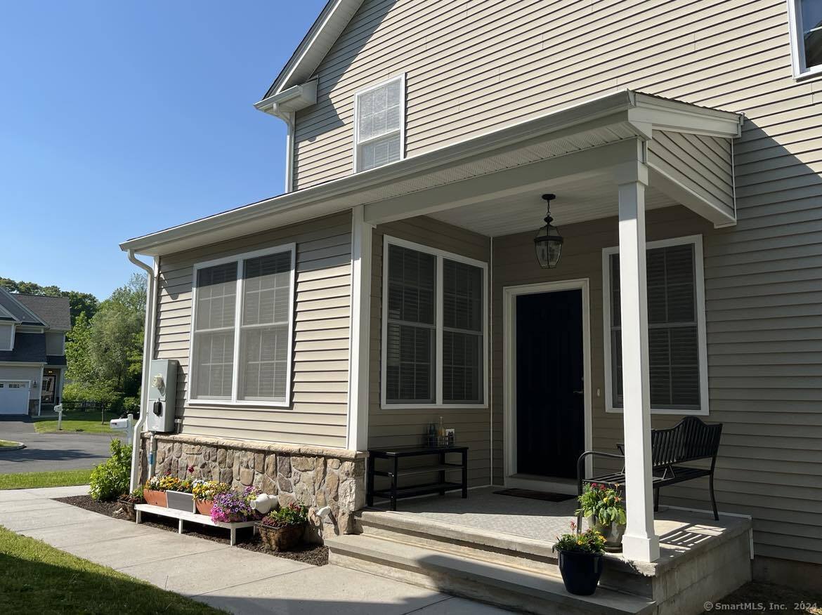 a front view of a house with a porch