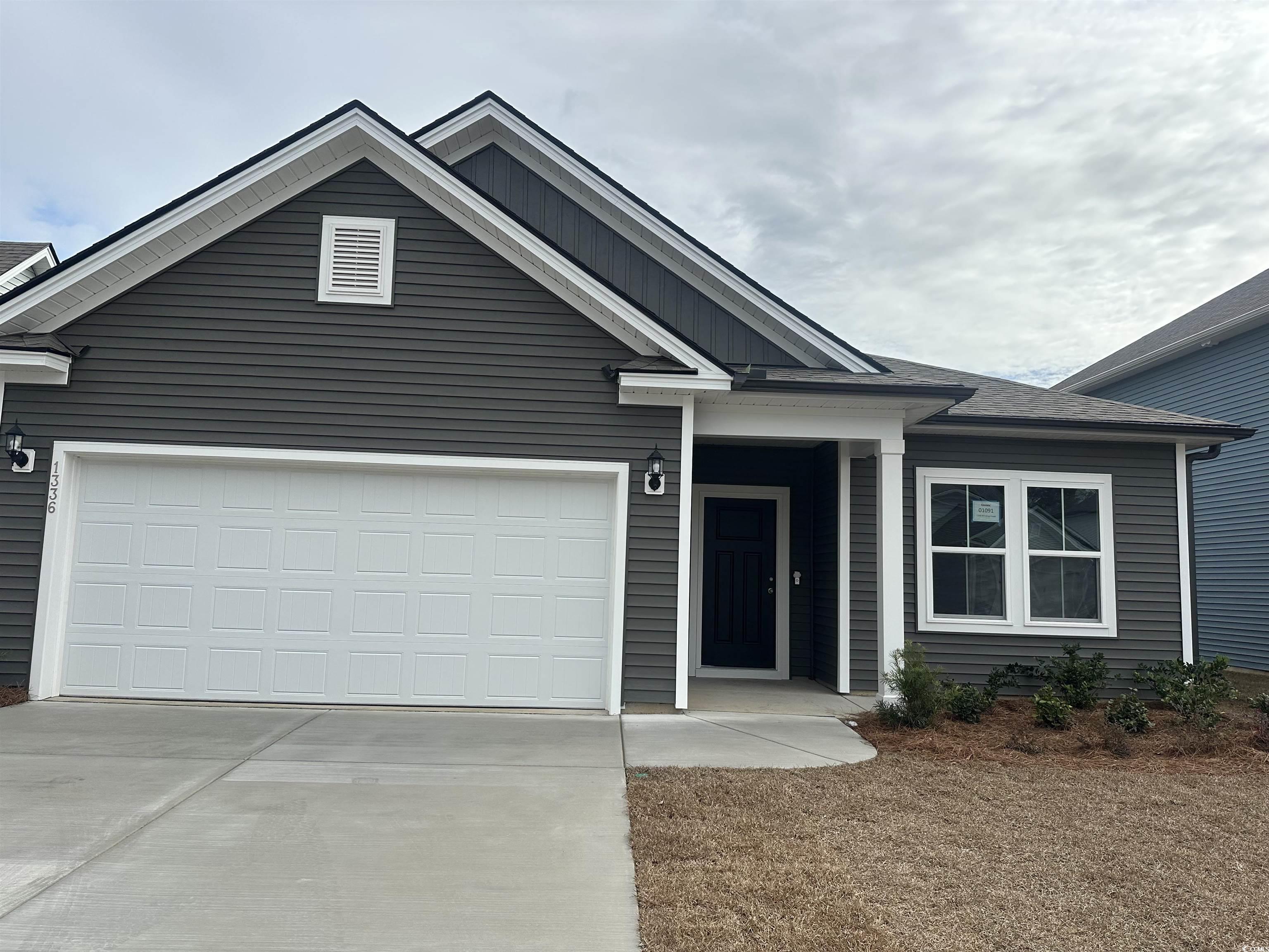 View of front of home featuring a garage