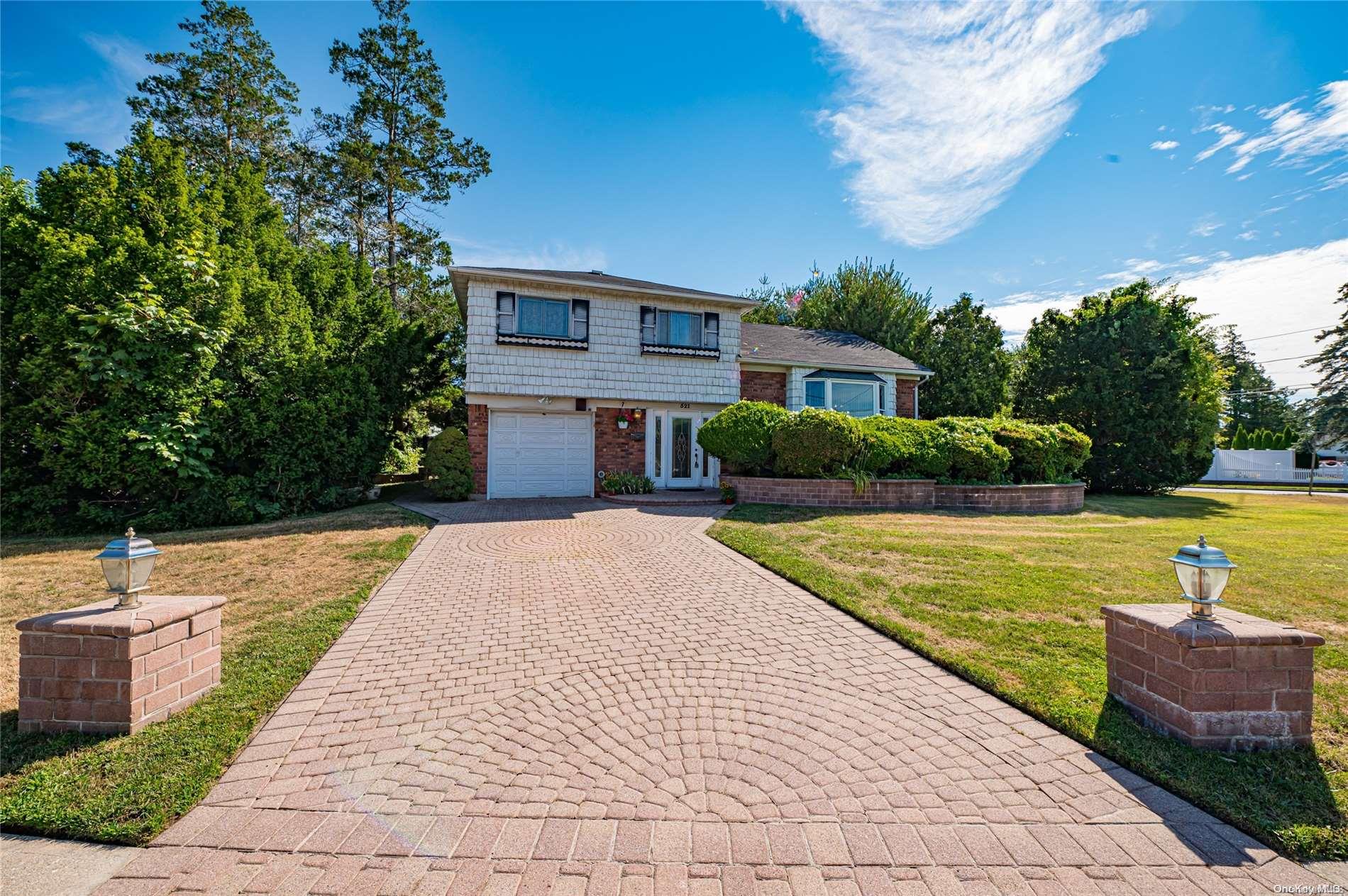 a view of a house with swimming pool and a yard