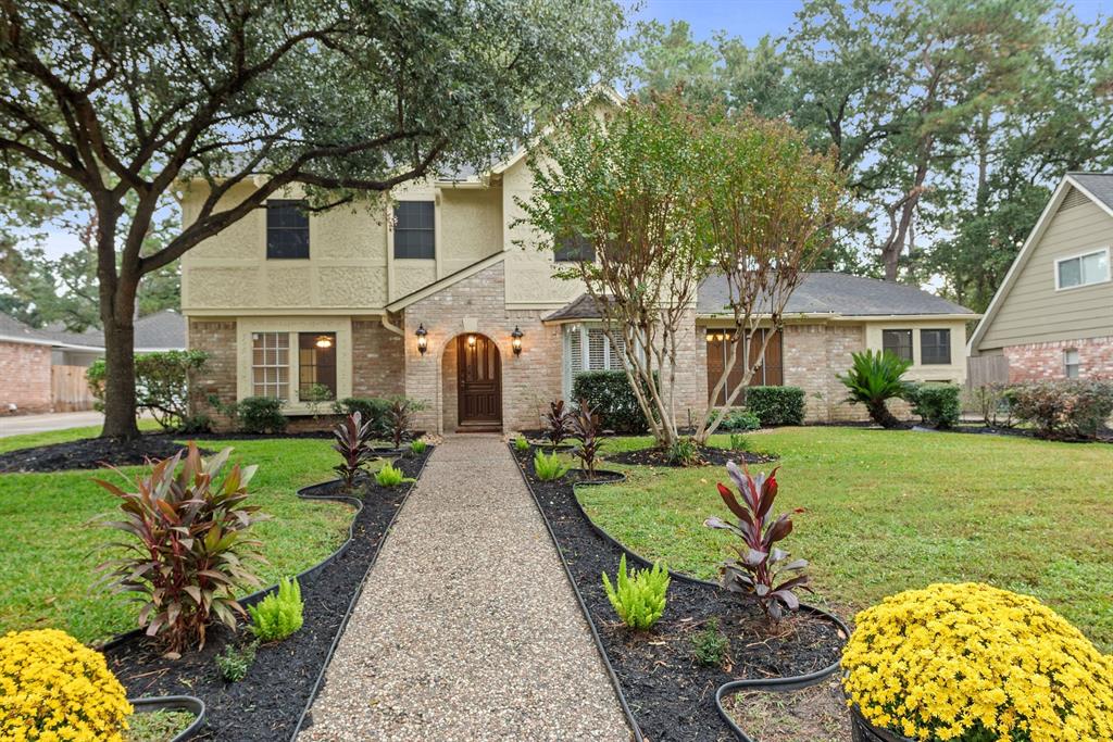 a front view of a house with garden