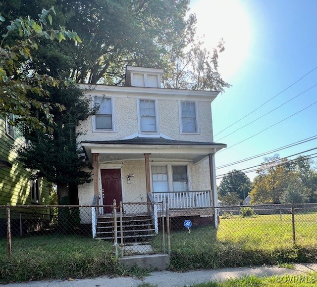 front view of a house with a yard