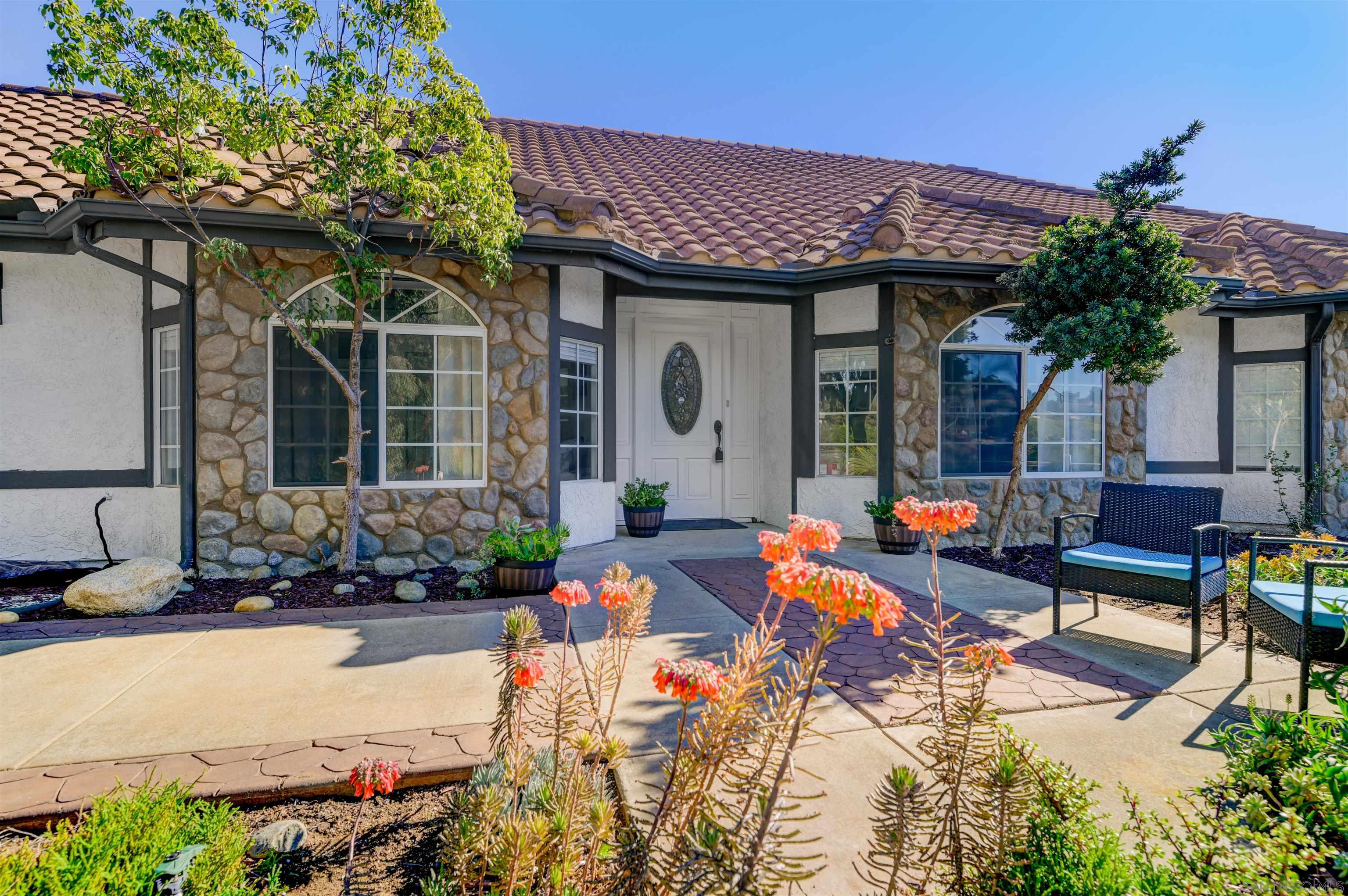 a front view of a house with patio outdoor seating