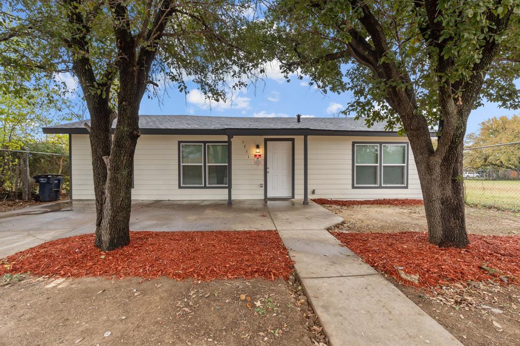 front view of a house with a yard