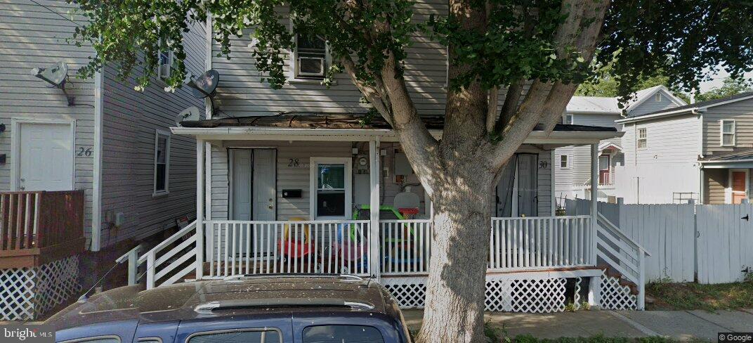 a view of a house with a small yard