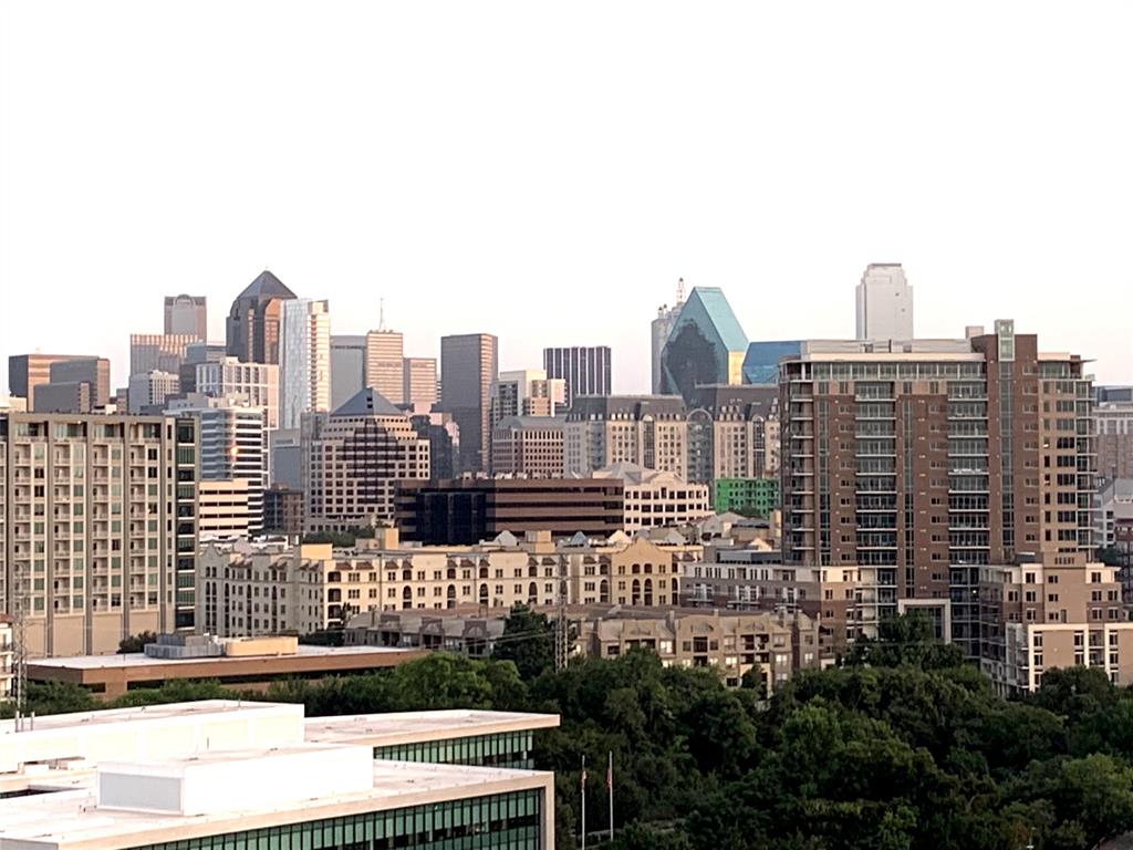 a view of a city with tall buildings