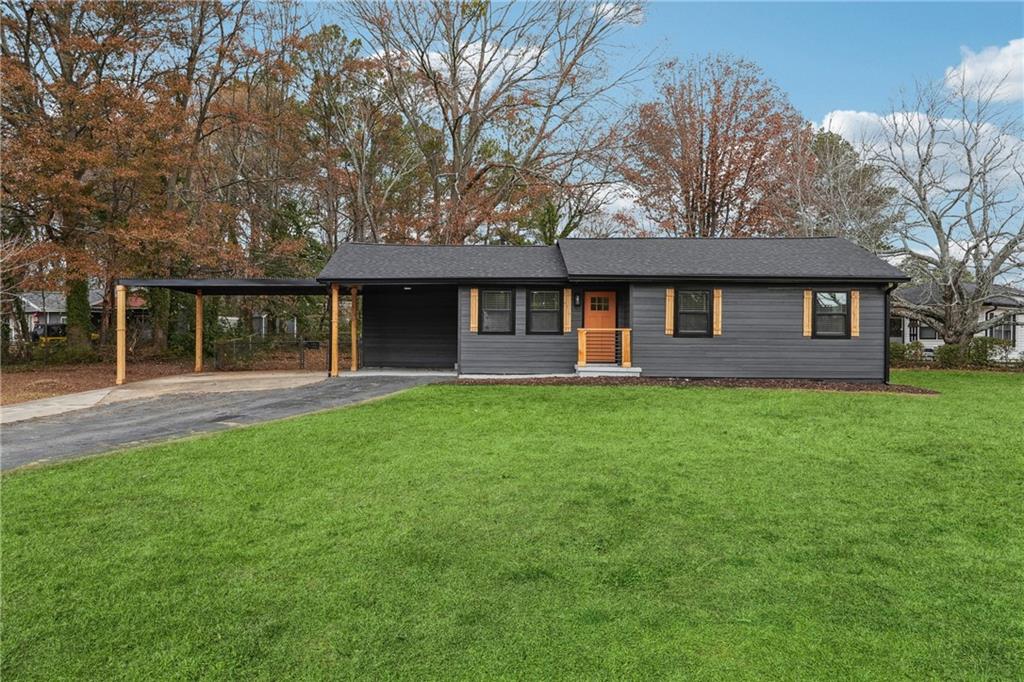 a front view of a house with a yard