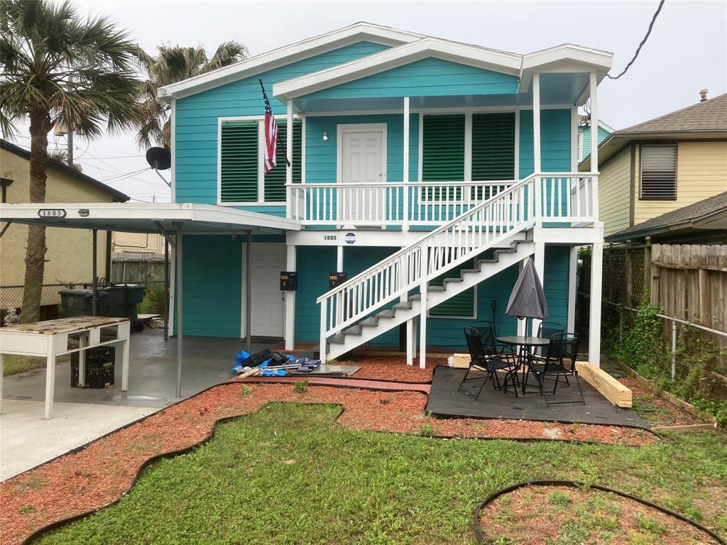 a house view with sitting space and garden