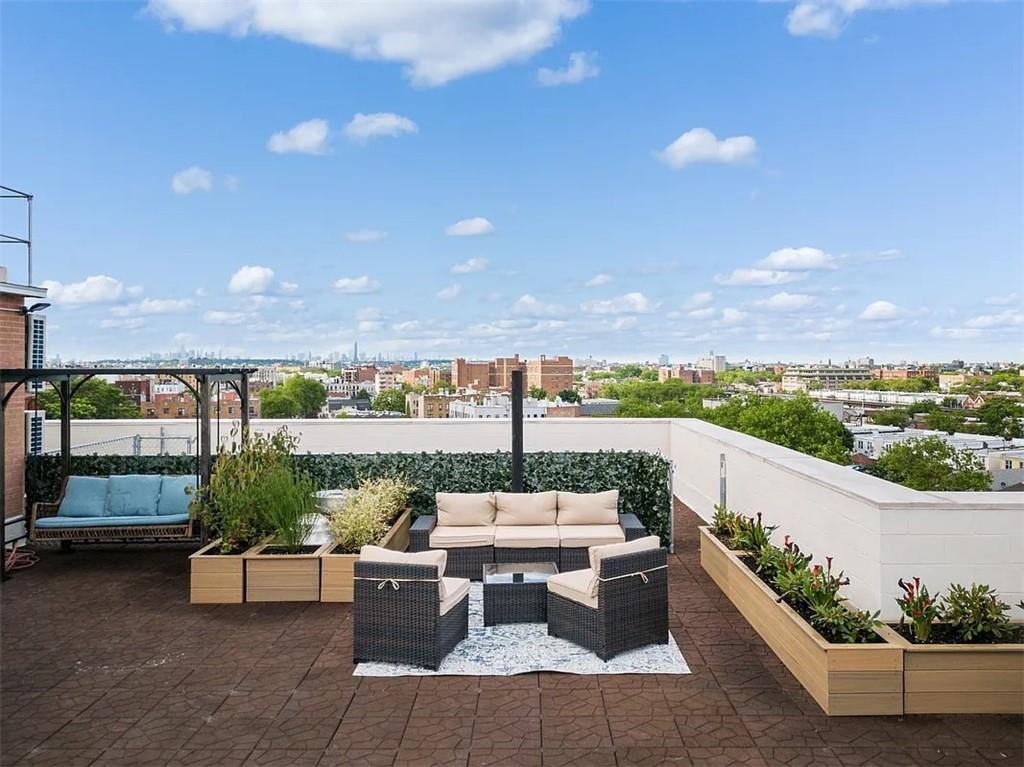 a view of a terrace with furniture and a potted plant