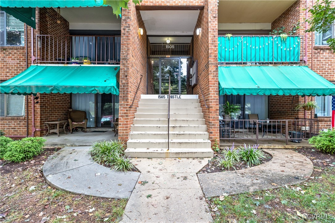 Entrance to property featuring a patio area and a