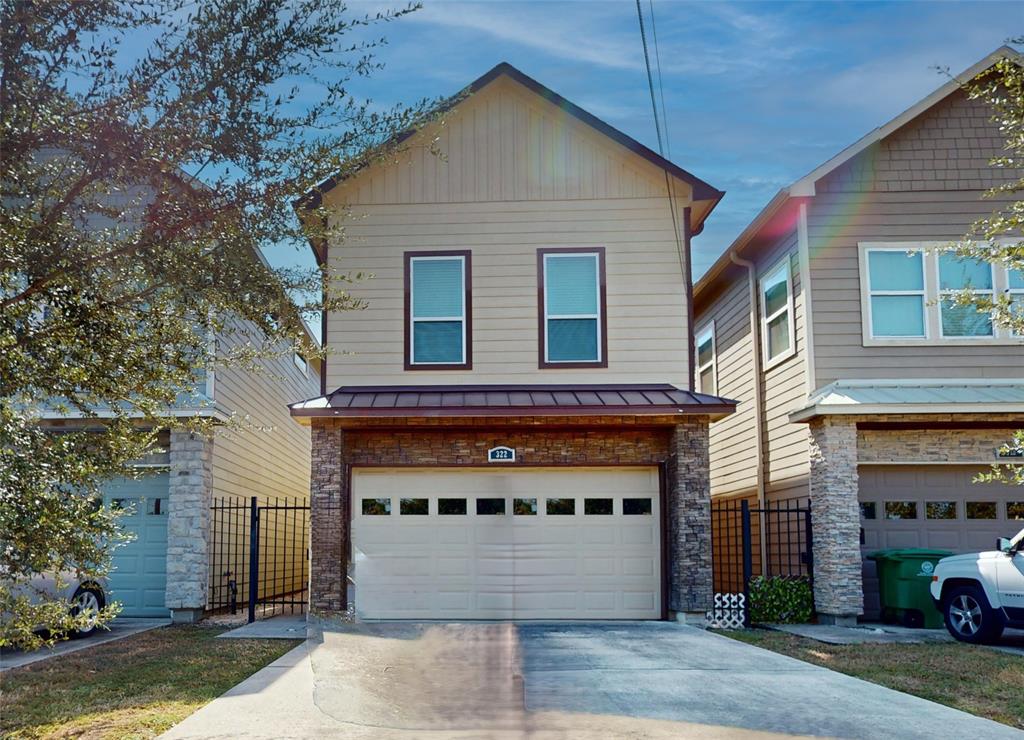 a front view of a house with a garage