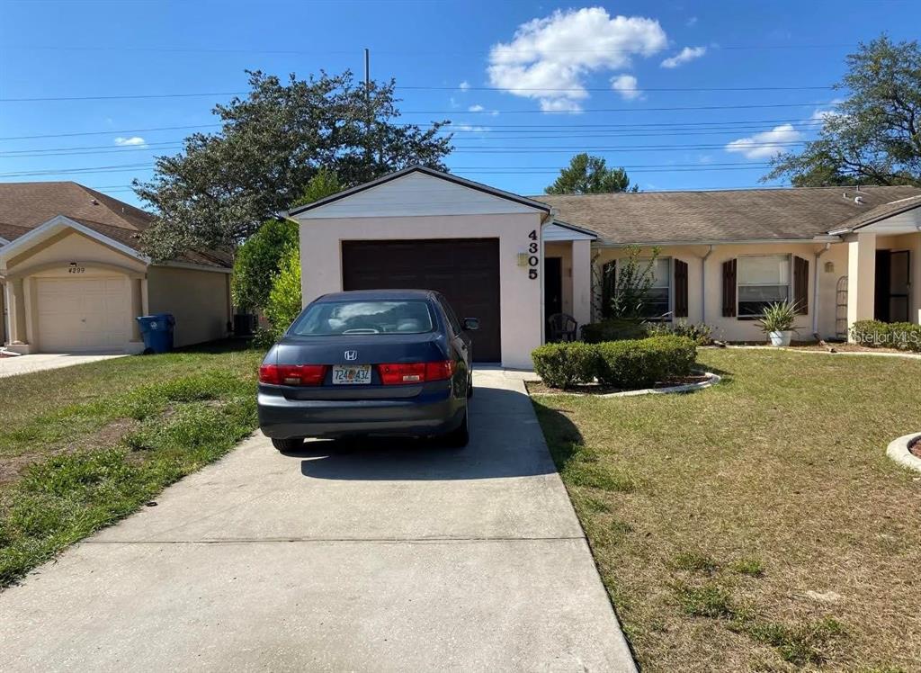 a car parked in front of a house