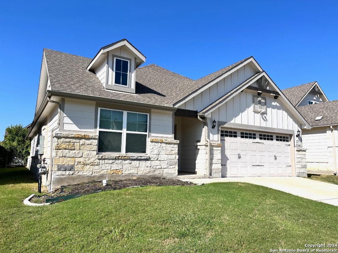 front view of a house with a yard