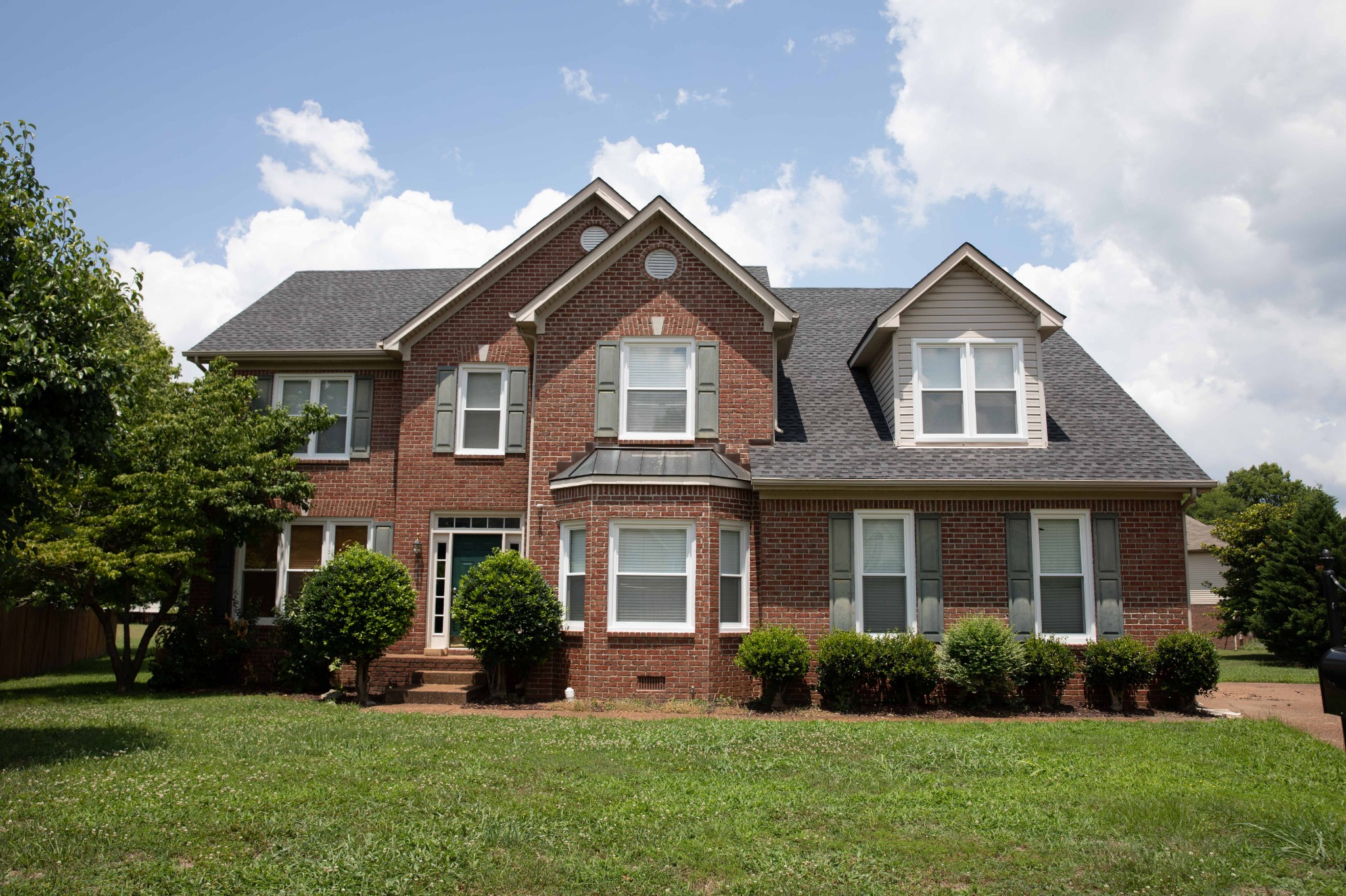 front view of a house with a yard