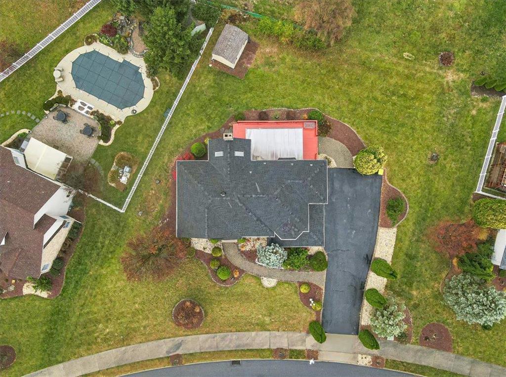 an aerial view of a house with swimming pool