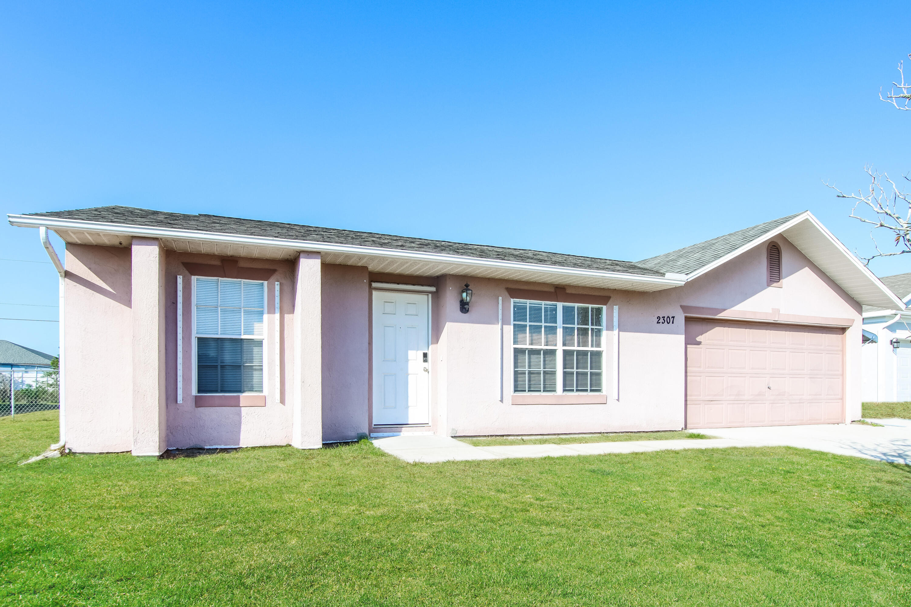 front view of a house with a yard