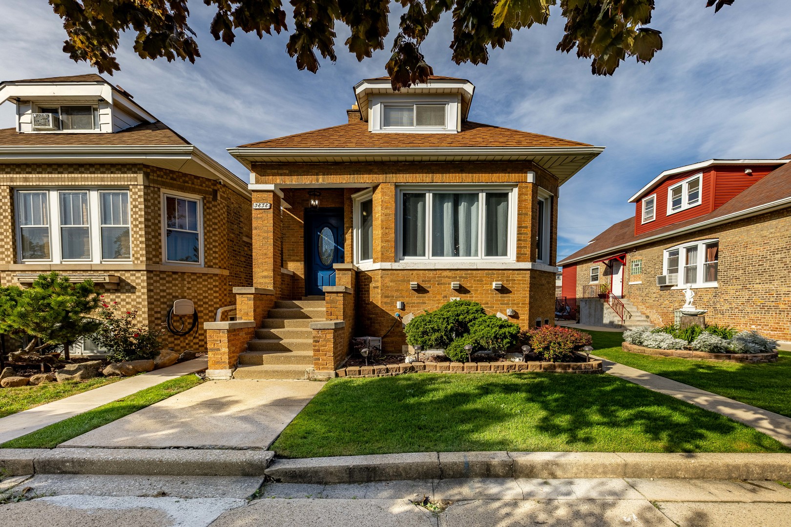 front view of a house with a yard