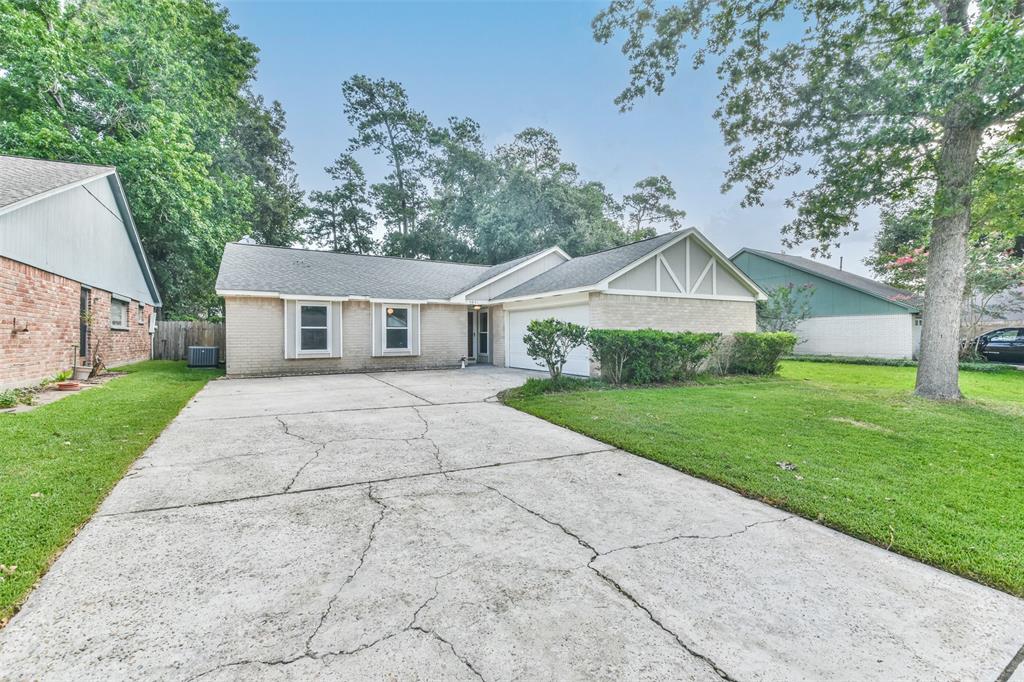 a view of house that has a yard