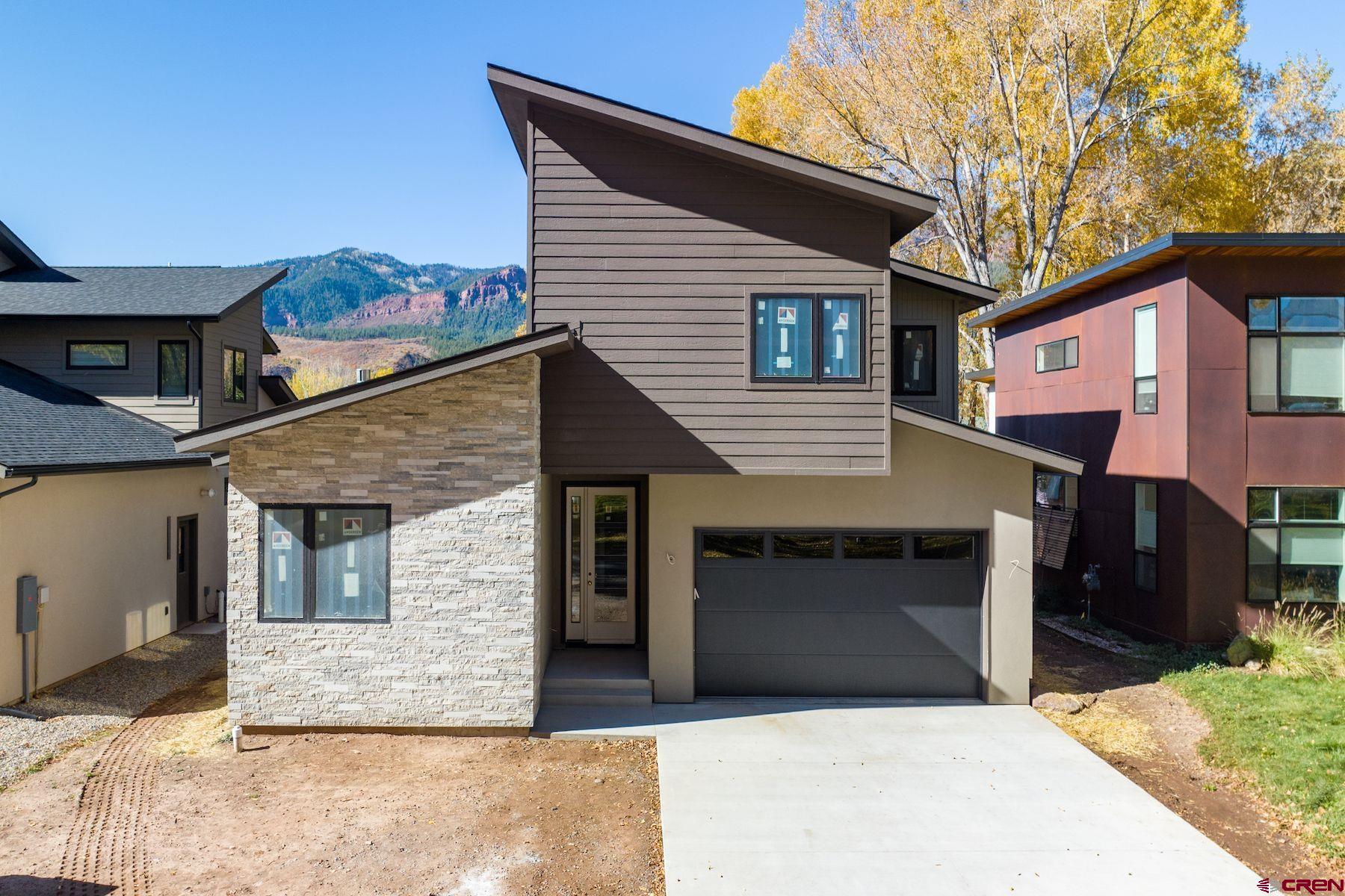 a front view of a house with a garage