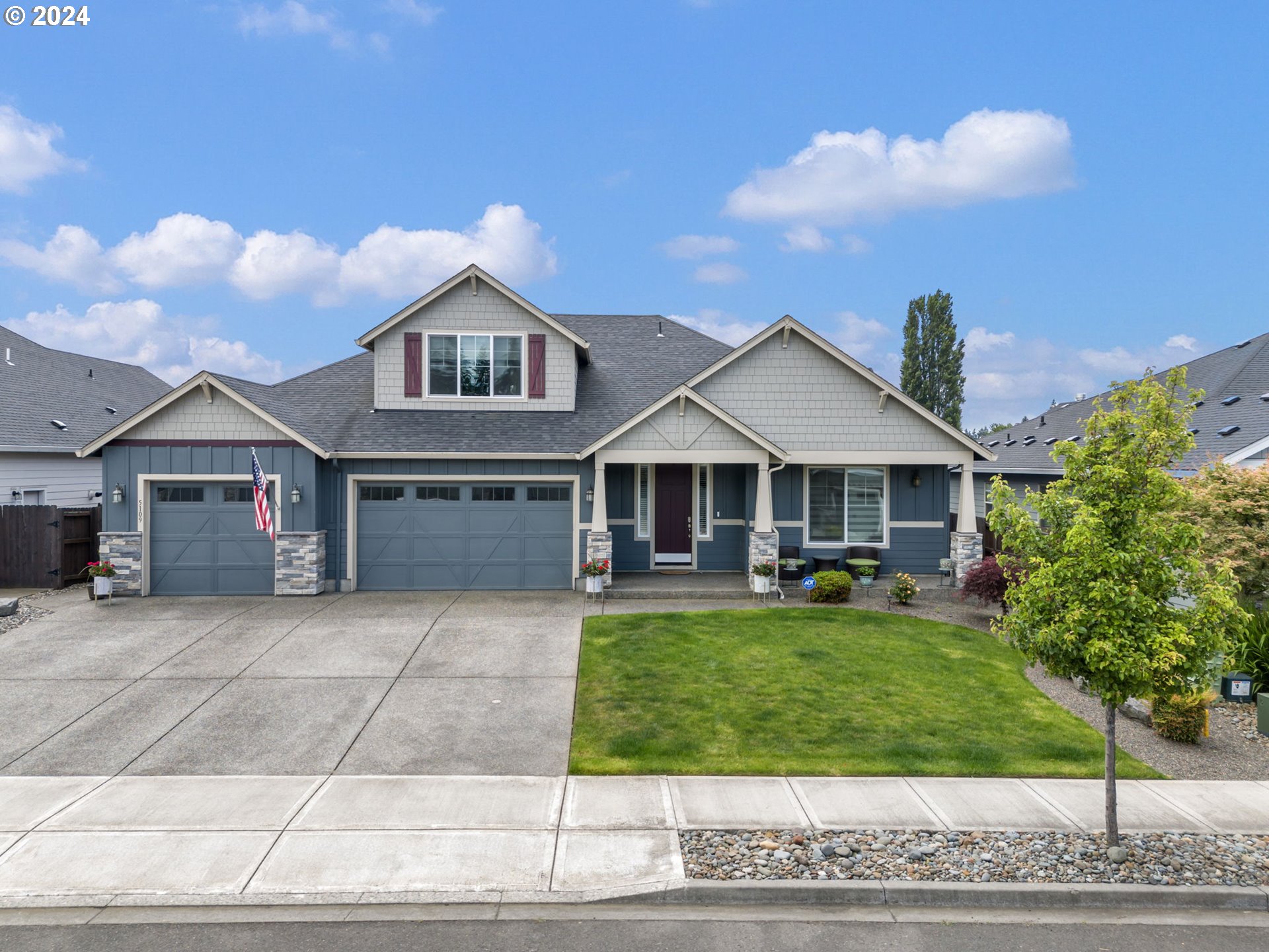 a front view of a house with garden