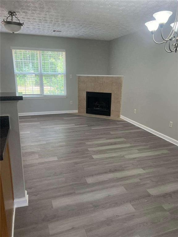 a view of empty room with window and fireplace