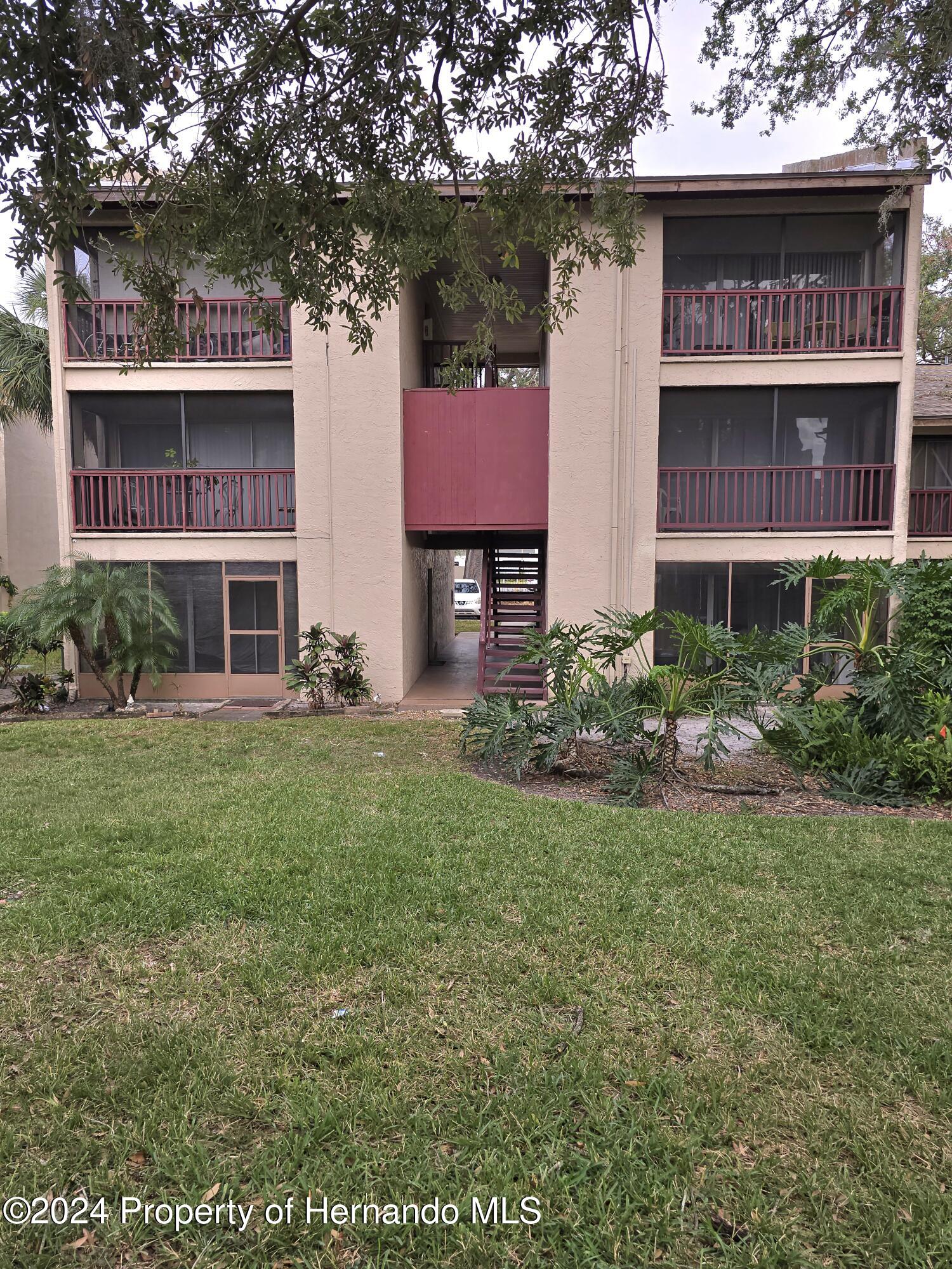 a front view of a building with garden