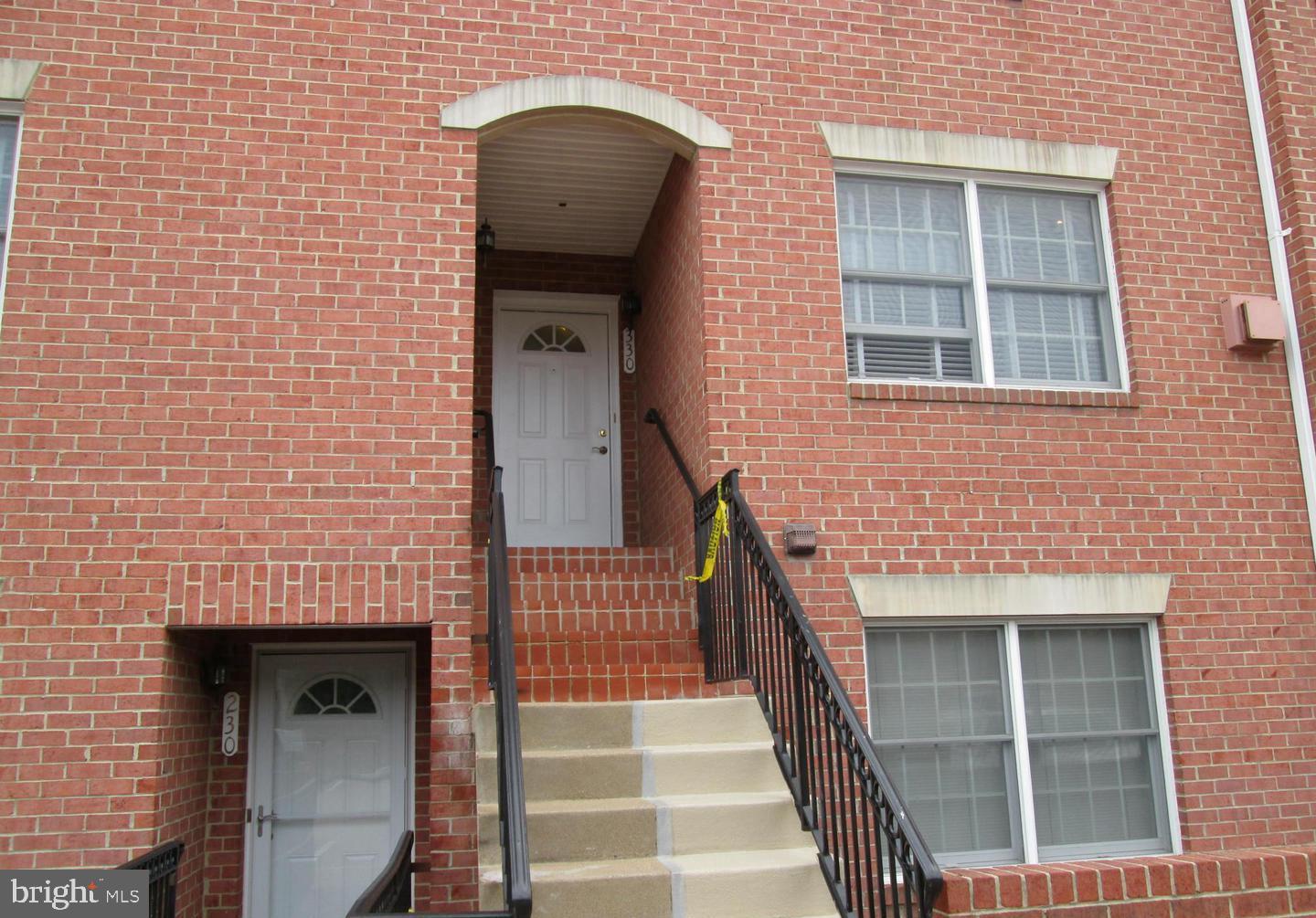 a front view of a house with stairs