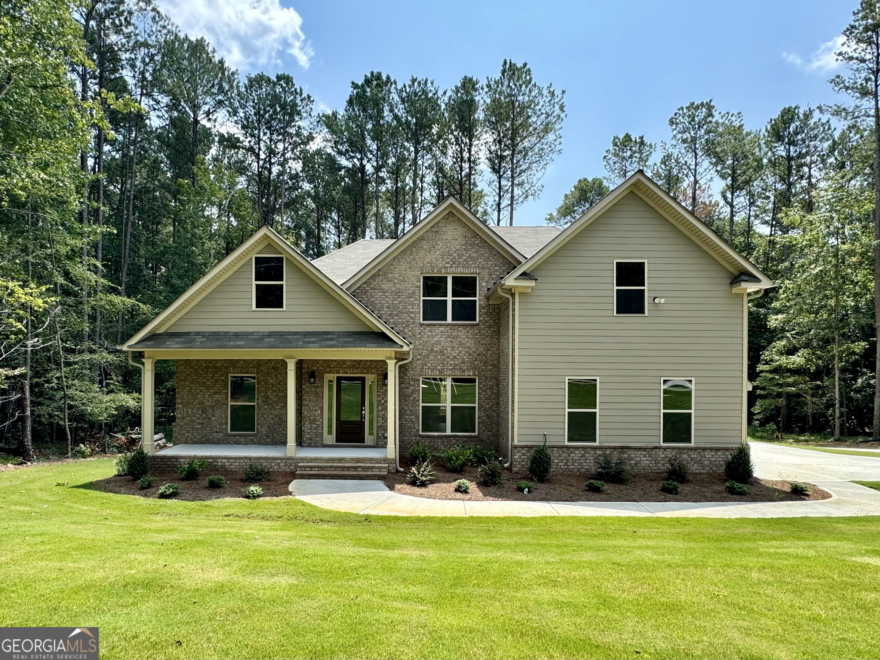 a front view of a house with a yard