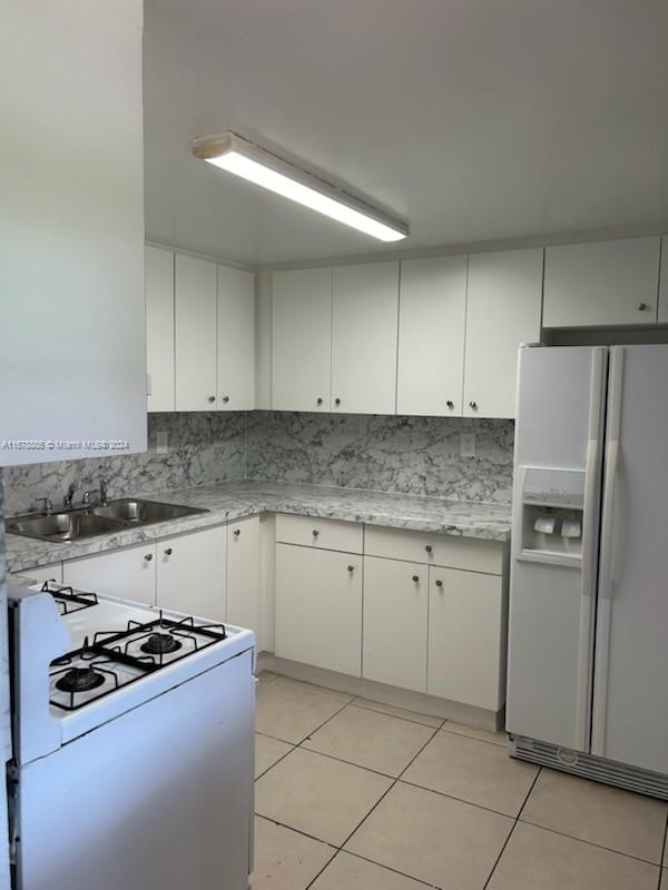 a kitchen with granite countertop cabinets and steel stainless steel appliances