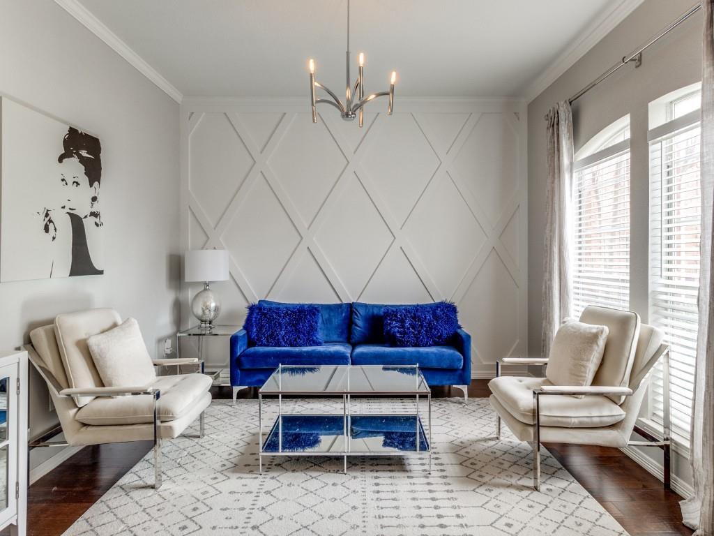 a living room with furniture a rug and a window