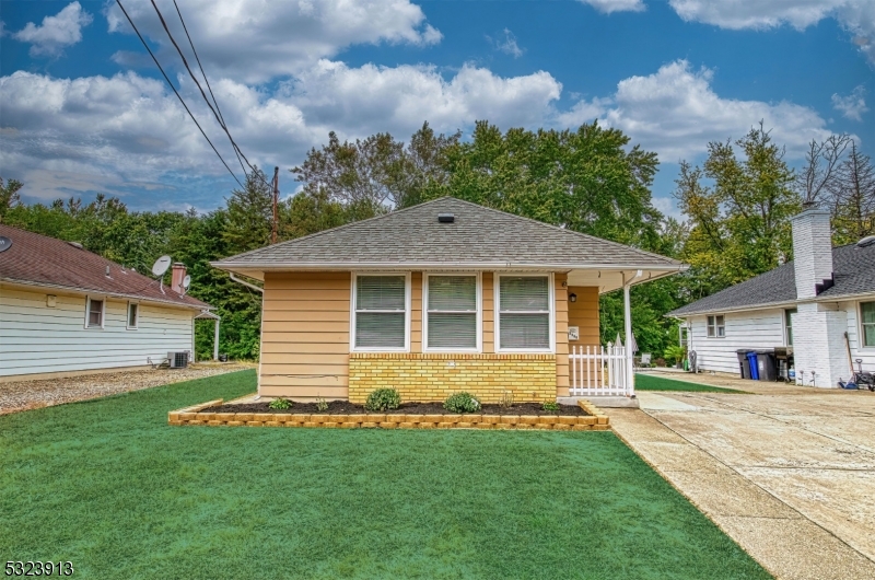 front view of a house with a yard