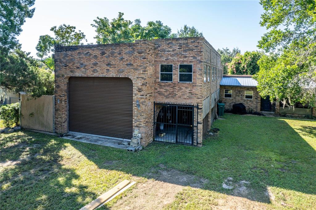 a view of house with yard and entertaining space