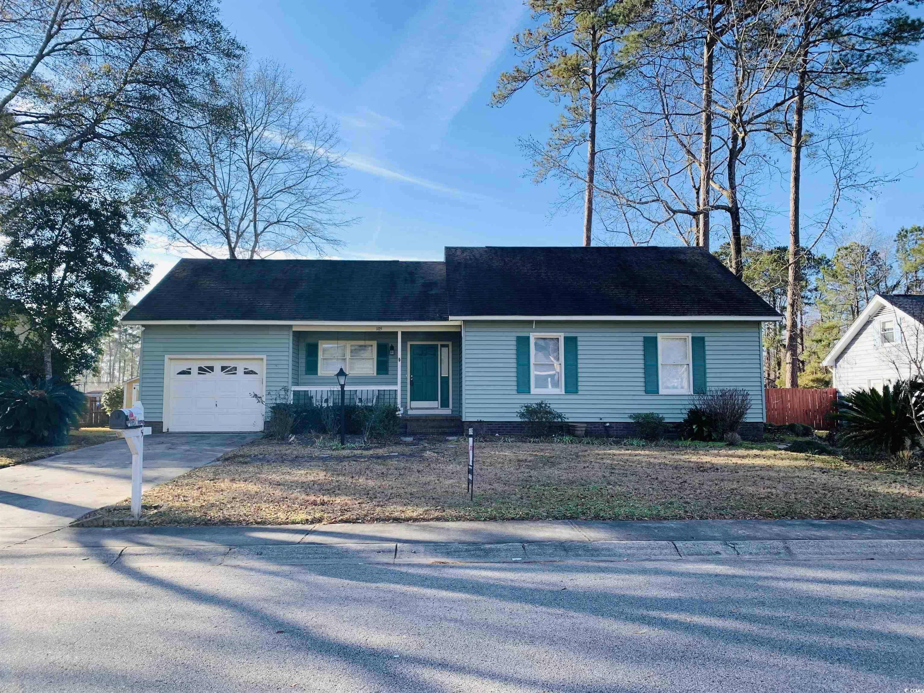 Single story home featuring a garage