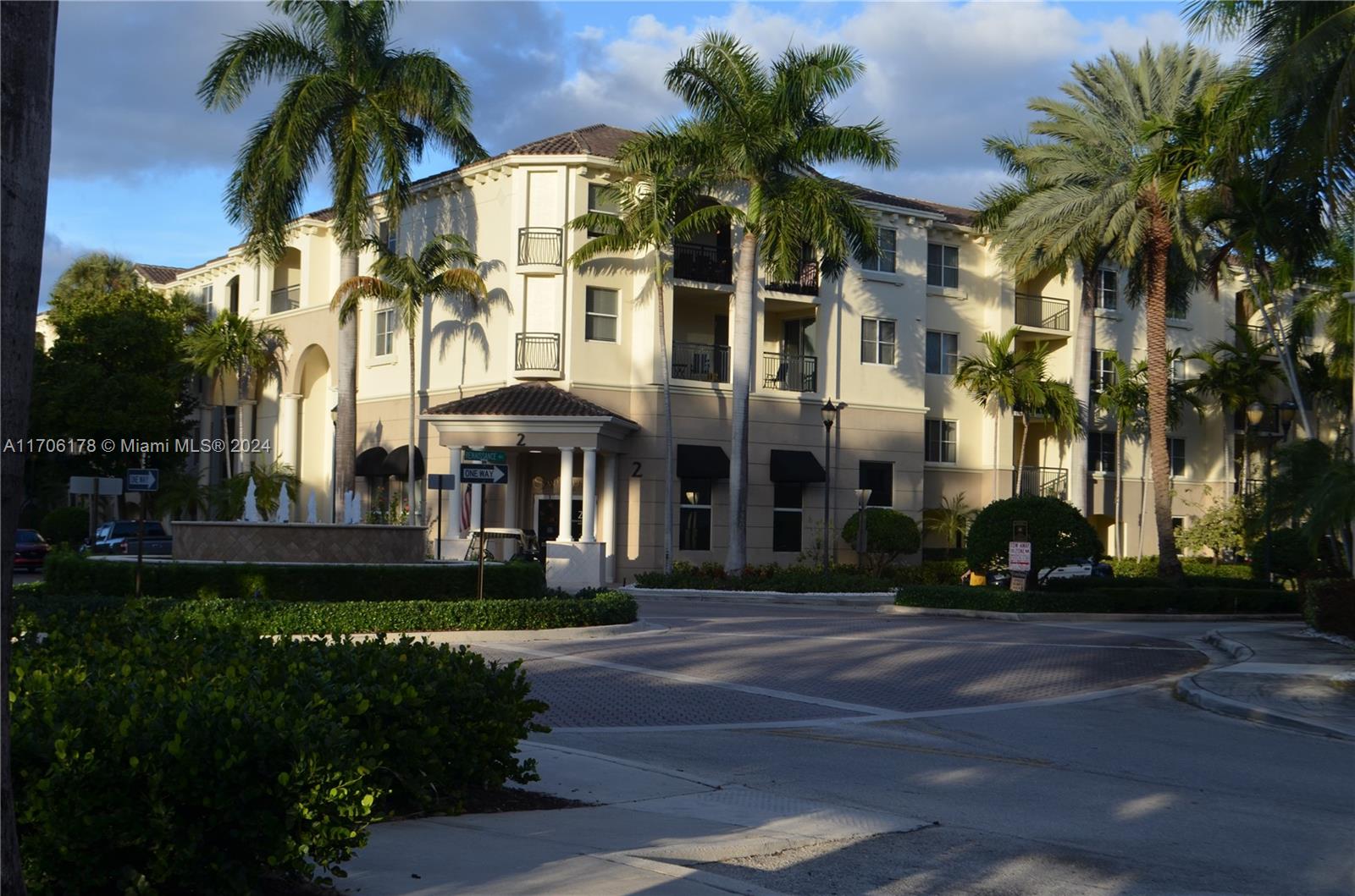 a front view of multiple houses with yard