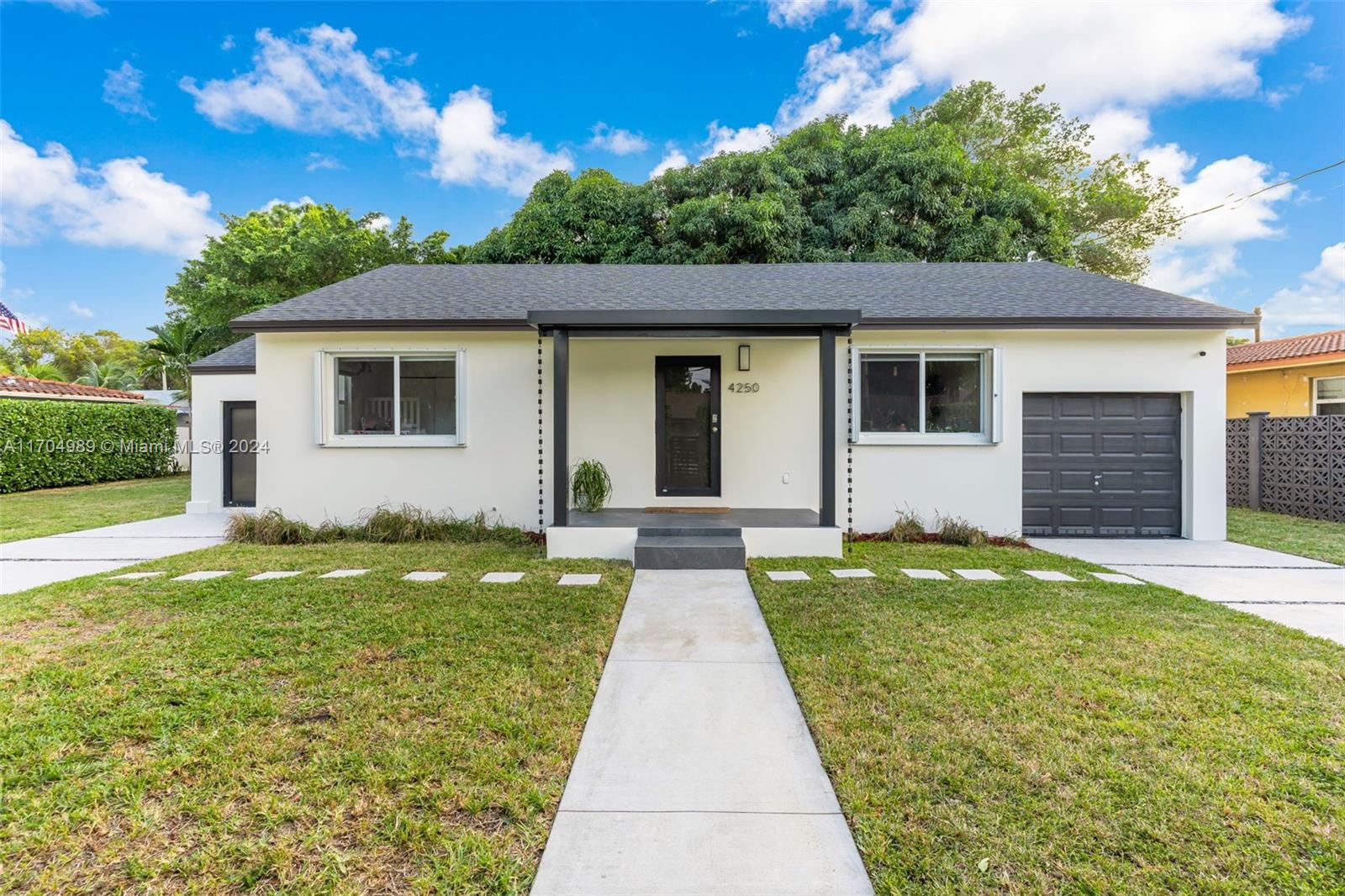 a front view of a house with yard