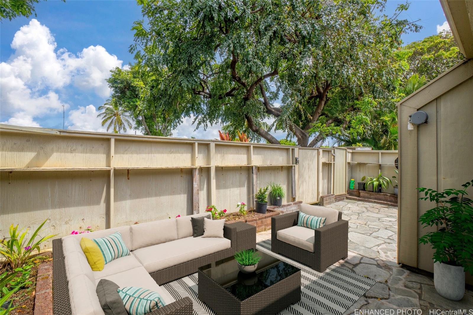 a outdoor space with patio couches and a potted plant